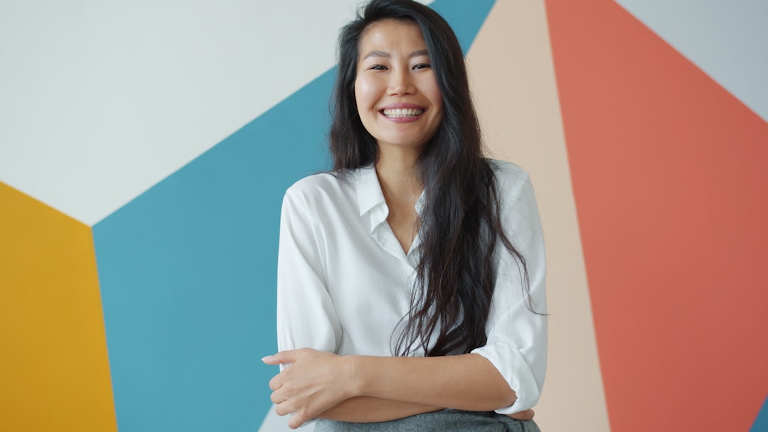 Financial advisor, certified financial planner, smiling in natural lighting